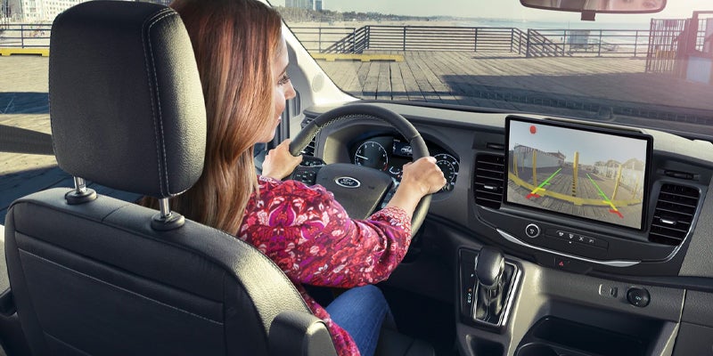 Interior view of a person using the backup camera.