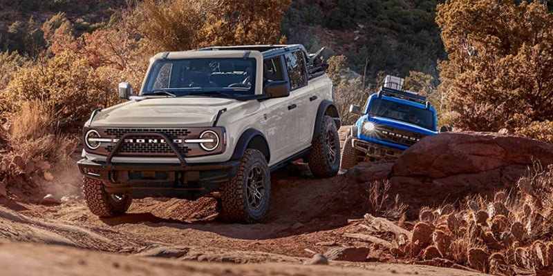 The Ford Bronco SUV driving on a rugged off-road trail.